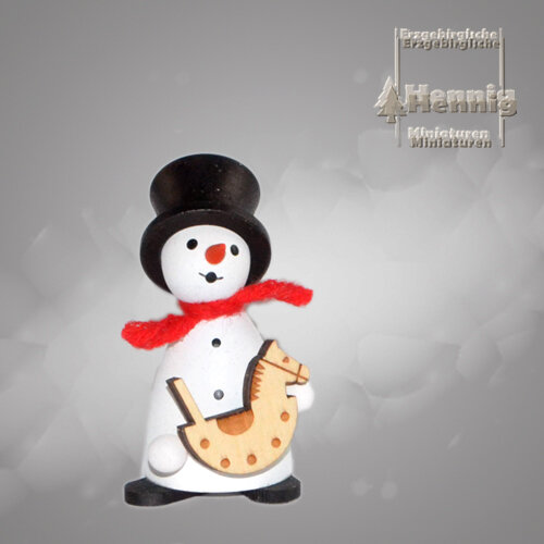Hennig Figuren - Schneemann mit Schaukelpferd